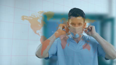 Animation-of-numbers-over-world-map-against-caucasian-male-doctor-wearing-face-mask-at-hospital