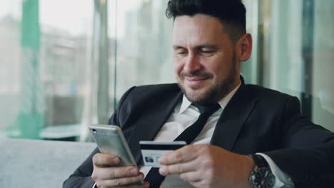 businessman making mobile payment
