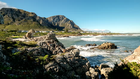 time lapse of atlantic waves crashing into rocky coastline in voëlklip hermanus