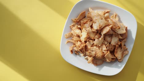 shredded chicken on a white plate