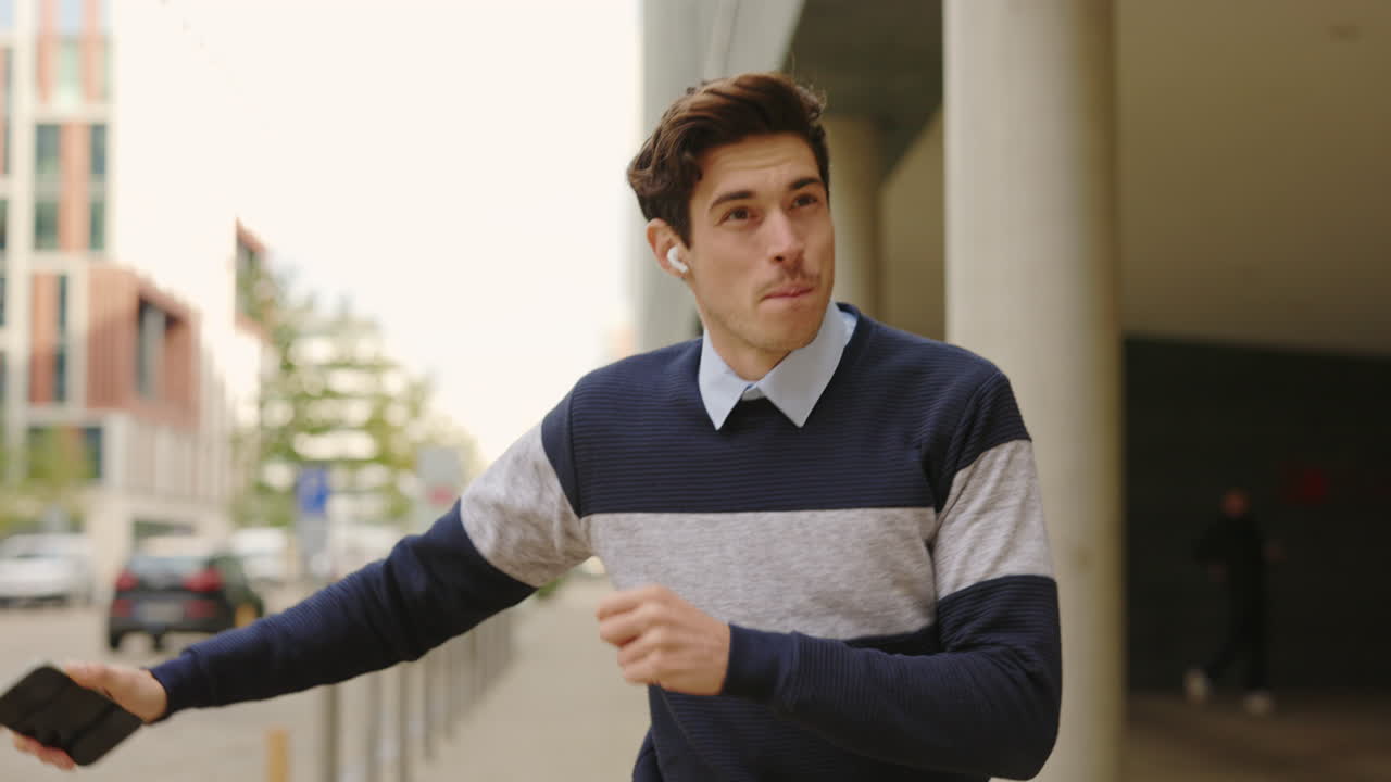 Man listening to music while walking in the city
