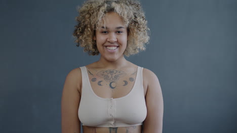 portrait of a happy woman with tattoos
