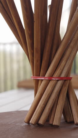 wooden sticks arrangement with red band