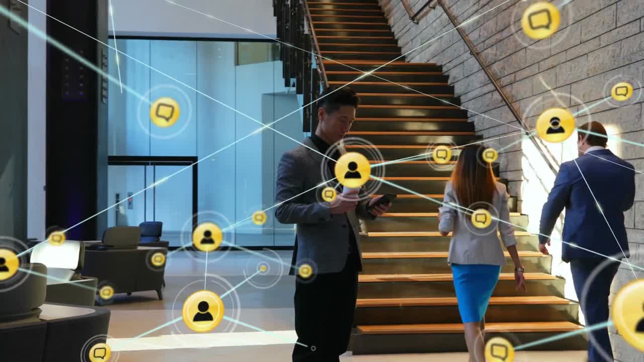 Animation of network of digital icons over asian businessman using smartphone at office