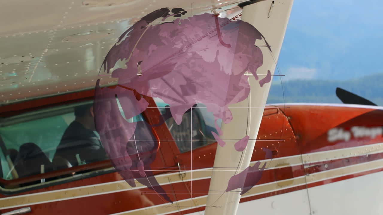 Rotating globe animation overlaying airplane wing during flight in clear sky