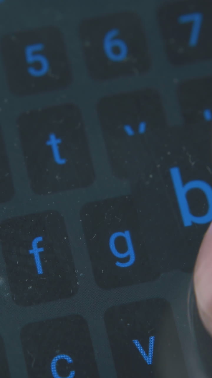 young person texts message on touch pad keyboard of modern smartphone with fingers extreme close view