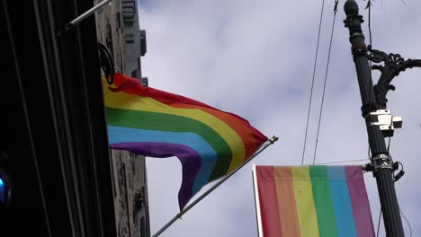 the pride flag is moving fast with a strong wind effect