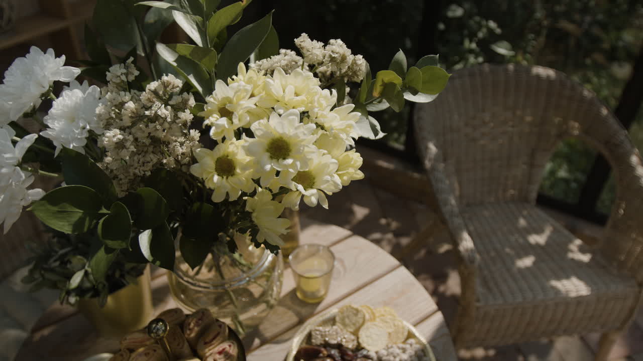 Outdoor Table Setting with Flowers and Snacks