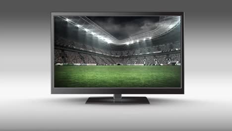 Flat-screen-TV-with-a-football-stadium-on-its-screen