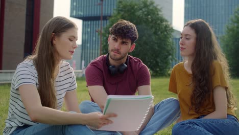 Group-of-caucasian-students-studying-outside-the-university-campus