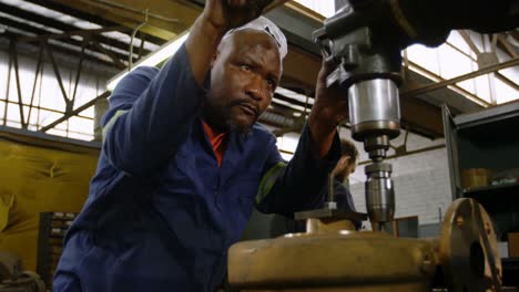 metalsmith working in workshop 4k