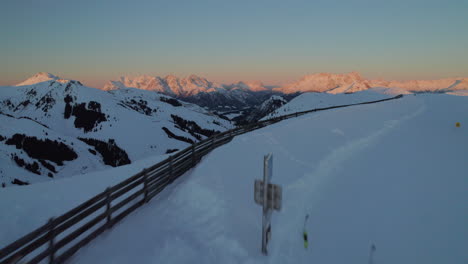 aerial view of snowy reiterkogel and hasenauer kopfl mountains in winter at sunrise in, hinterglemm, austria