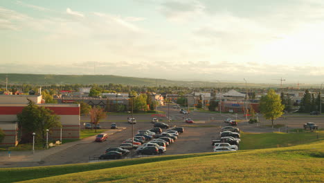 overlook of parking lot at a community centre in a suburban neibourhood during a warm golden hour