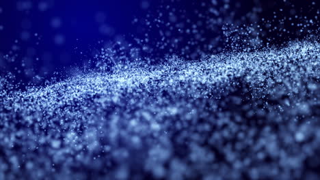 bright glowing shiny particles chaotically moving on a dark blue background. looped animation for a festival, club party.