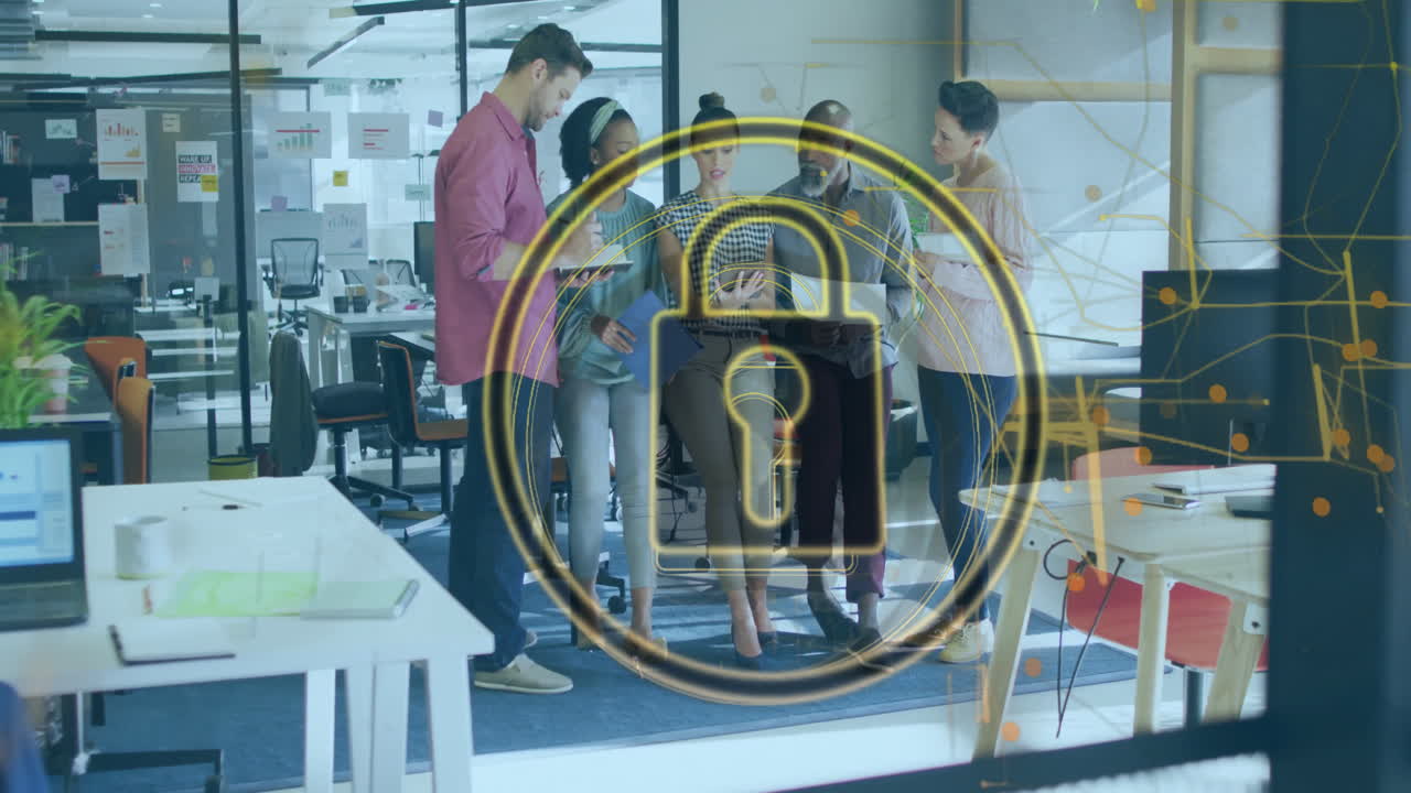 Diverse team collaborating in office with digital security lock animation overlay