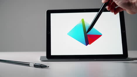 tablet with digital pen and graphic design interface