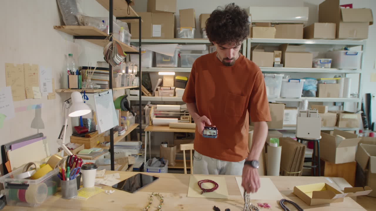 Man Photographing Jewelry for Selling Online
