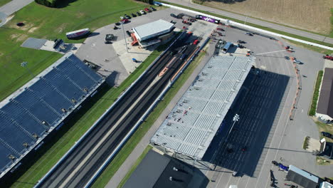 Wide-drone-shot-of-drag-strip-race-track-with-stands