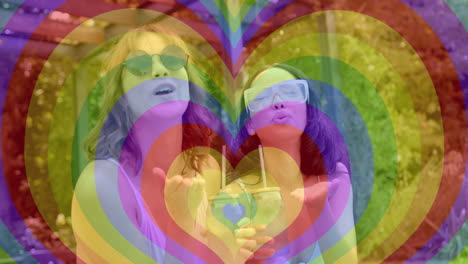 blowing kisses outdoors, women with colorful heart shapes animation around them