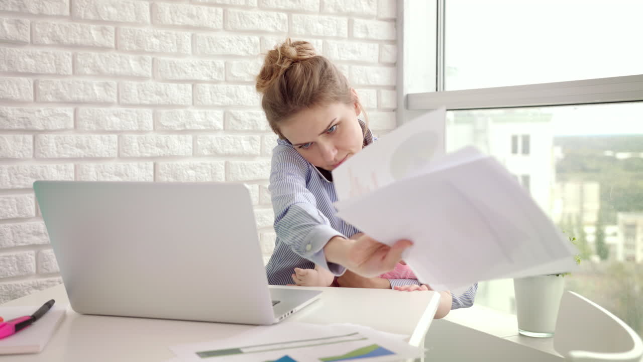 Baby distracted mother from conversation. Modern woman working from home