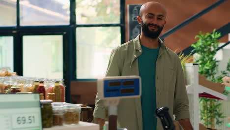 salesperson weighs produce and groceries