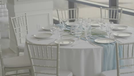 Catering reception tables prepared for wedding guests