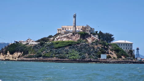 alcatraz island and former federal prison buildings, close up view from san francisco bay, california usa