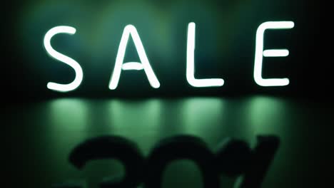 composition of neon sale text on black background