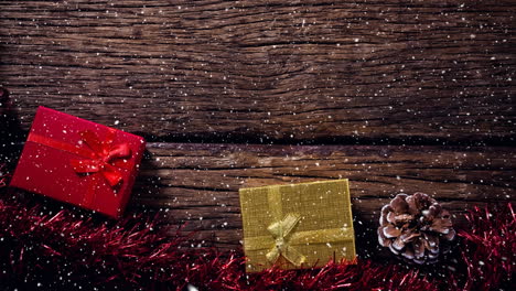 nieve cayendo con regalos de navidad en la madera