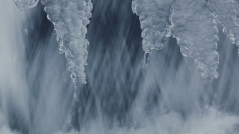 nature background. small waterfall in winter. water flowing in winter