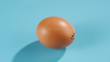 chicken egg on blue background top view. preparing for easter, painting and decorating eggs. celebrating christian holiday, family traditions.