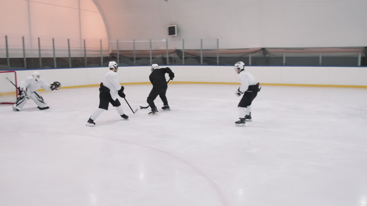 Hockey Player Scoring Goal Into Net
