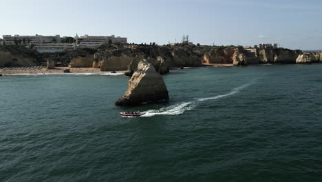 Drone-Video-of-Boat-on-the-Coast-of-the-Algarve,-Portugal