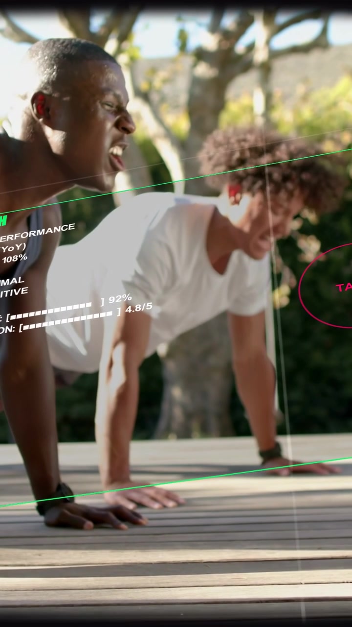 Vertical video: Two men starting plank, doing pushups on deck, fitness HUD guiding reps, red target