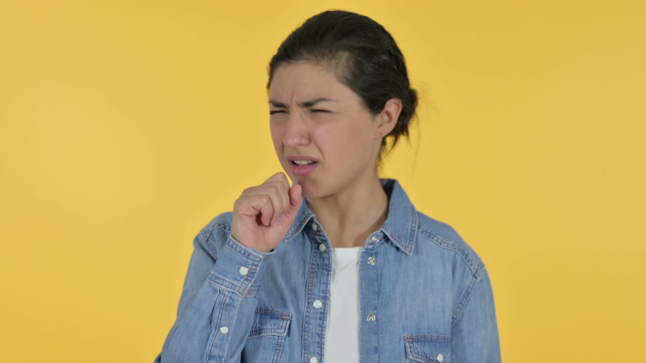 Sick Young Indian Woman Coughing, Yellow Background