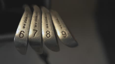 close-up of a set of stainless steel golf irons