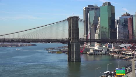 the brooklyn bridge east river and fdr parkway on a clear sunny day in new york city 1