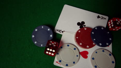 cards chips and dice falling on casino table