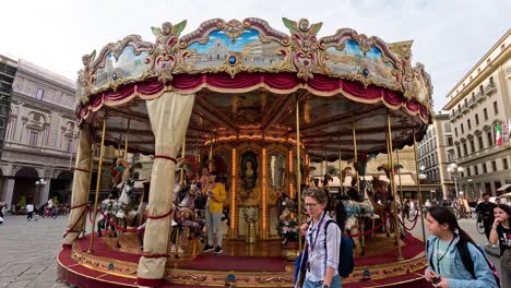 people enjoying a carousel in florence, italy