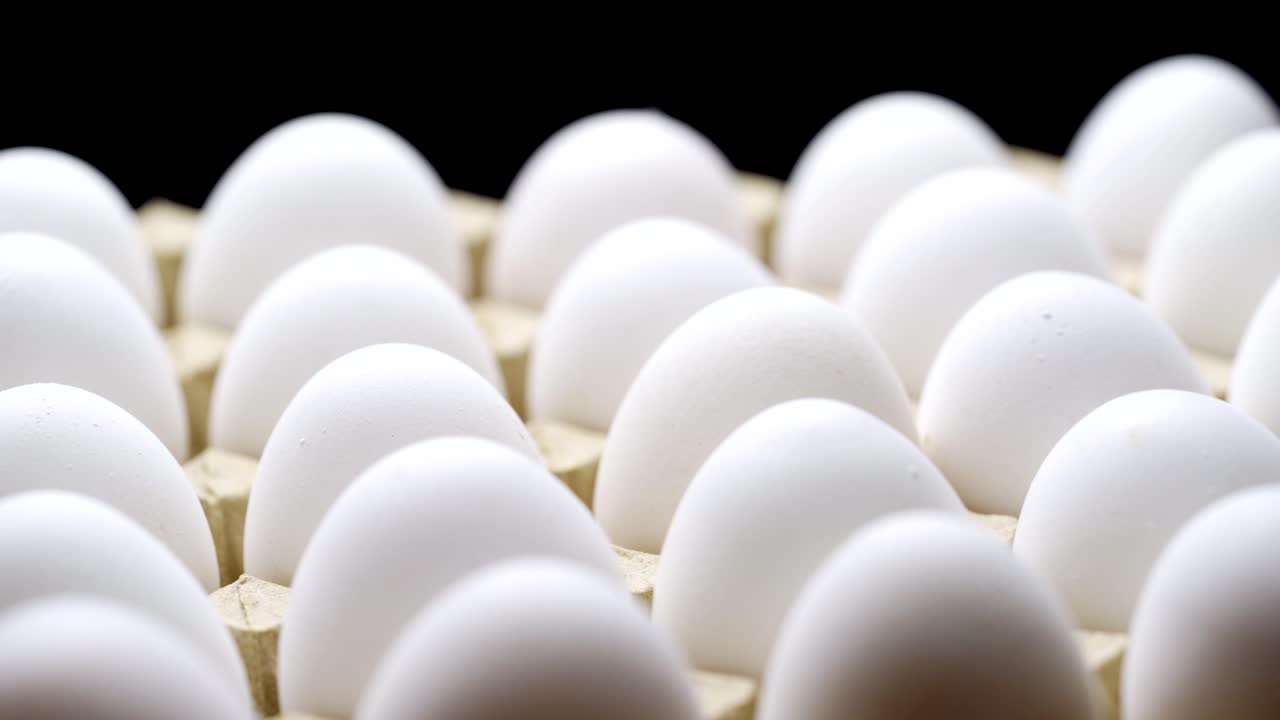 White chicken eggs in a cardboard box. Eggs in a paper tray.