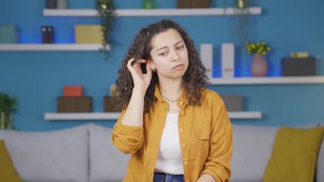 young woman with itchy ears.