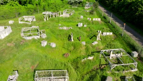 Men-Playing-Paintball-On-Paintball-Field-With-Obstacles-and-Bunkers-On-A-Sunny-Day-In-Summer