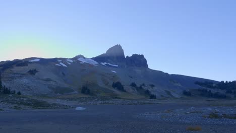 jagged black tusk peak against bright sky in garibaldi provincial park in canada