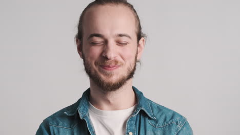 caucasian young man yawning on camera.