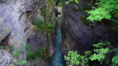 emerald water of mountain river streaming through high cliffs of canyon in albania