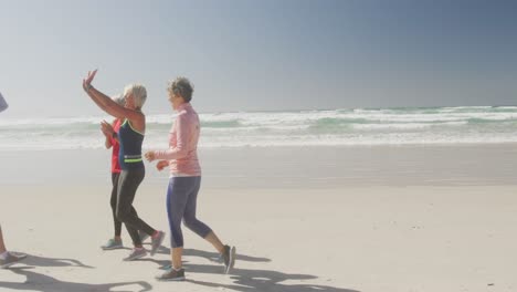 athletic women having fun on the beach