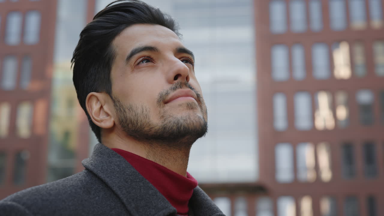 Portrait of a man looking up in the city