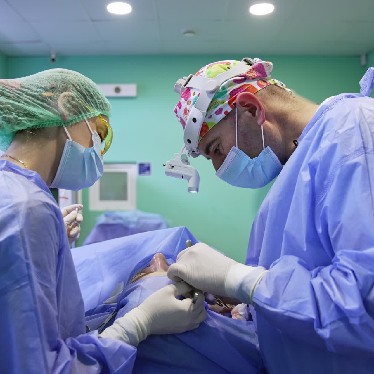 Modern cosmetic procedure on eyelids. Surgeon skillfully using metal tools at delicate operation