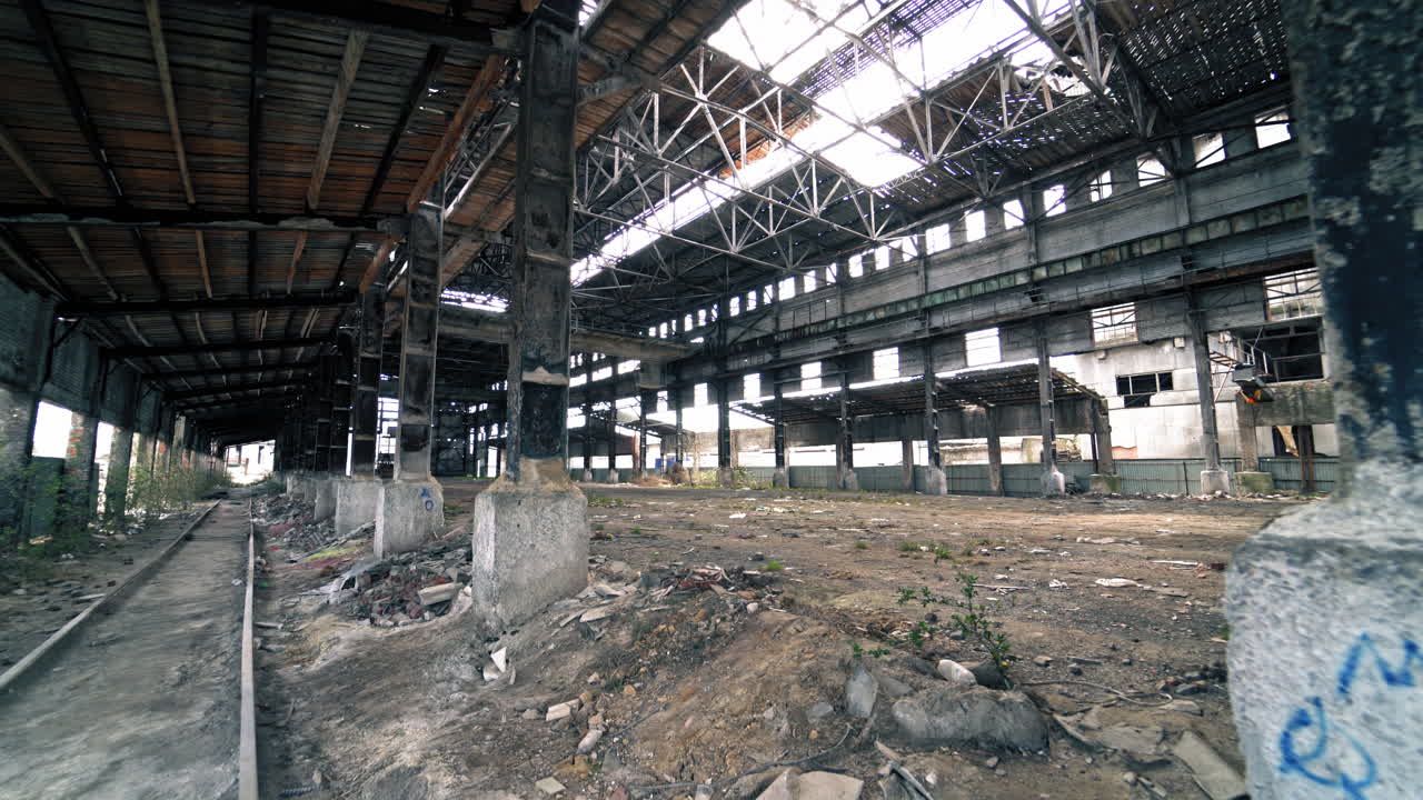 Abandoned and haunted industrial creepy warehouse inside. Old ruined factory building.