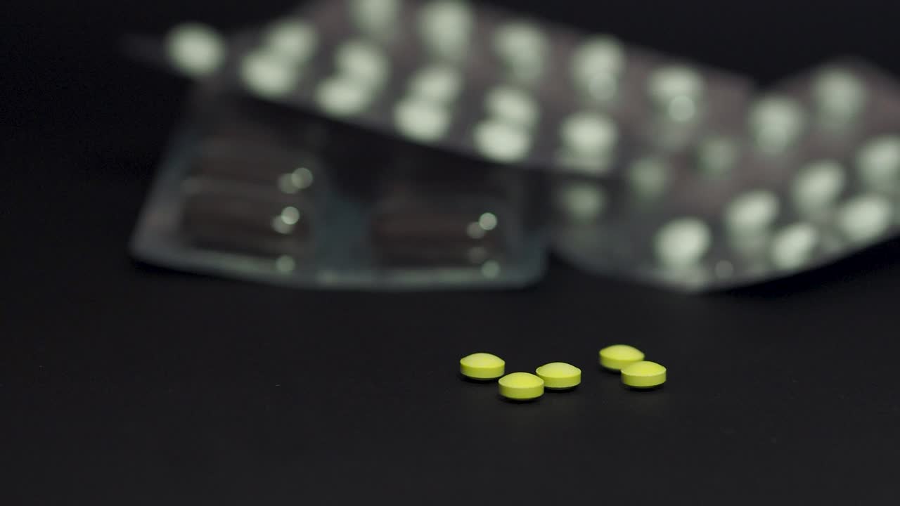 Slide shot of blisters with pills. Infection control concept. COVID 2019.Scene C.